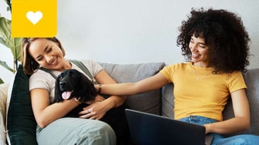 Strata Condo Owners on Couch Reading Bylaws